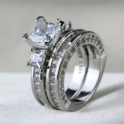 YOHAPP NEW Fashion Couple Rings Set Jewelry - Men's 8mm 316L Stainless Steel Titanium Ring and Women's Three Stone Princess Cut 1CT Diamond   Silver  Bridal Wedding Engagement Band Ring