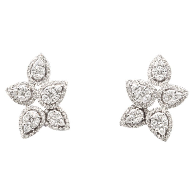 https://a.1stdibscdn.com/diamond-cluster-earrings-for-sale/j_415/j_140275121637952988477/j_14027512_1637952989428_bg_processed.jpg?width=768