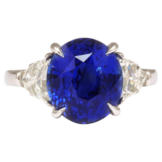 https://a.1stdibscdn.com/6-carat-oval-blue-sapphire-and-diamond-ring-for-sale/j_415/j_144397421641927170096/j_14439742_1641927170668_bg_processed.jpg