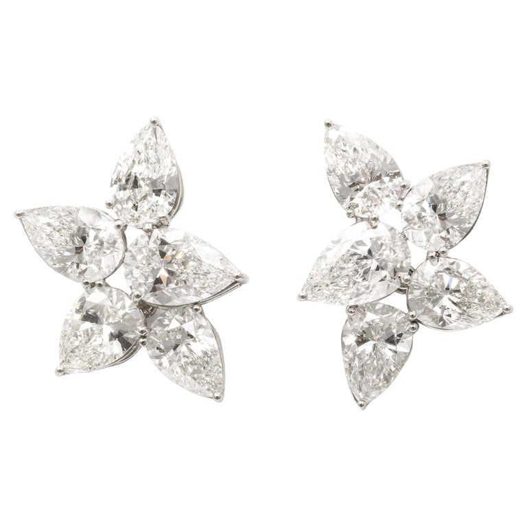 https://a.1stdibscdn.com/diamond-cluster-earrings-for-sale/j_415/j_145871221643387905695/j_14587122_1643387906578_bg_processed.jpg?width=768
