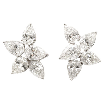 https://a.1stdibscdn.com/diamond-cluster-earrings-for-sale/j_415/j_145871221643387905695/j_14587122_1643387906578_bg_processed.jpg?width=768