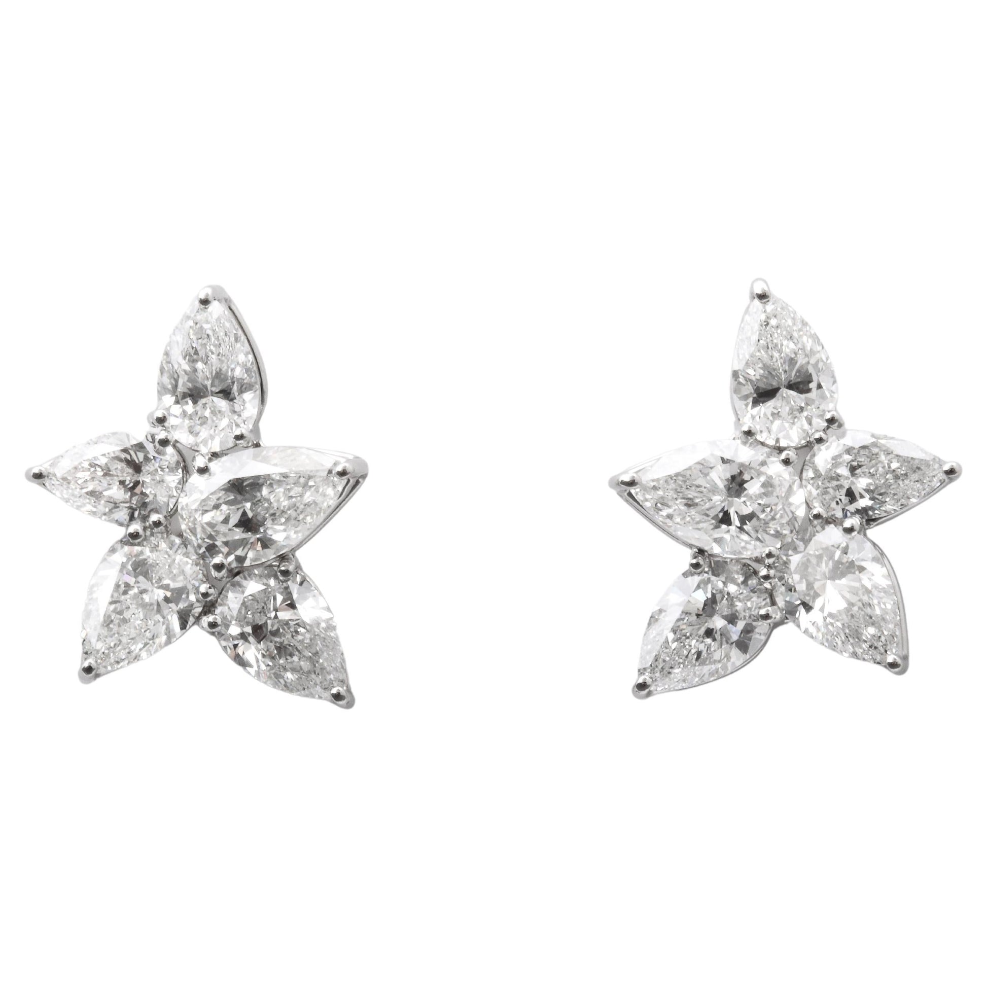 https://a.1stdibscdn.com/cluster-diamond-earrings-for-sale/j_415/j_167933421661437813581/j_16793342_1661437814487_bg_processed.jpg